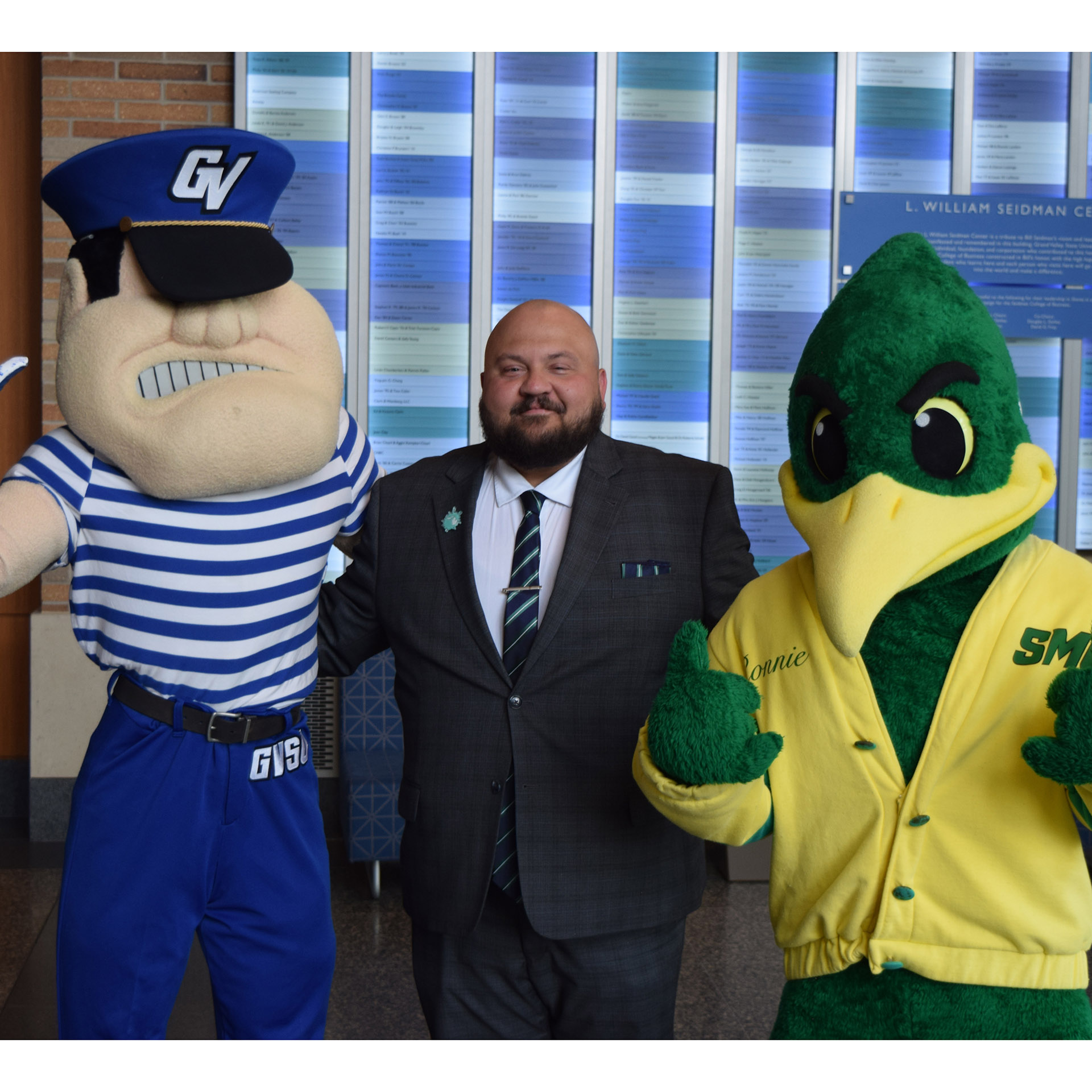 Branden Pompey with both mascots of his alma maters